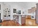 Spacious kitchen with island, hardwood floors, and stainless steel appliances at 6700 S Gator Creek Blvd, Sarasota, FL 34241