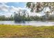 Serene lake view with a gazebo and lush greenery at 6700 S Gator Creek Blvd, Sarasota, FL 34241