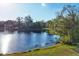 Scenic lake view with mature trees and tranquil waters at 6700 S Gator Creek Blvd, Sarasota, FL 34241