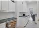 Laundry room with built-in cabinets and workspace at 6700 S Gator Creek Blvd, Sarasota, FL 34241