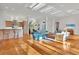 Spacious living room with hardwood floors, natural light, and open floor plan at 6700 S Gator Creek Blvd, Sarasota, FL 34241