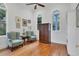 Bright office with hardwood floors, two armchairs, and built-in shelving at 6700 S Gator Creek Blvd, Sarasota, FL 34241