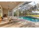 Relaxing pool area with covered patio at 6700 S Gator Creek Blvd, Sarasota, FL 34241