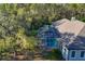 Screened pool with surrounding deck and trees at 6700 S Gator Creek Blvd, Sarasota, FL 34241