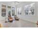 Relaxing sunroom with comfy chairs and pool view at 6700 S Gator Creek Blvd, Sarasota, FL 34241