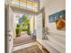 Bright and airy entryway with built-in bench seating and access to backyard at 6847 Bay Hill Dr, Lakewood Ranch, FL 34202