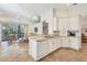 Spacious kitchen with island and breakfast bar, open to the Gathering room at 6847 Bay Hill Dr, Lakewood Ranch, FL 34202