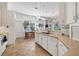 Well-equipped kitchen with white cabinets and breakfast nook at 6847 Bay Hill Dr, Lakewood Ranch, FL 34202