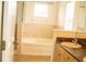 Bathroom featuring a shower, tub, vanity with light wood cabinets, and tile backsplash at 731 Cristelle Jean Dr, Ruskin, FL 33570