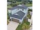 Two-story light blue house with gray roof and attached garage at 731 Cristelle Jean Dr, Ruskin, FL 33570