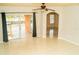 Inviting living space with sliding glass doors to a deck and neutral decor at 731 Cristelle Jean Dr, Ruskin, FL 33570