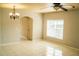 Open-concept living space with tile floors, neutral paint, and ample natural light at 731 Cristelle Jean Dr, Ruskin, FL 33570