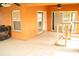 Covered patio area with tile flooring, ceiling fans, and sliding glass doors leading indoors at 731 Cristelle Jean Dr, Ruskin, FL 33570