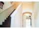 Interior staircase with hardwood steps, white risers, and a view of open living area at 731 Cristelle Jean Dr, Ruskin, FL 33570