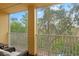 Screened balcony overlooking lush trees and natural scenery at 7325 Black Walnut Way, Lakewood Ranch, FL 34202