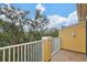 Private balcony with tranquil wooded views at 7325 Black Walnut Way, Lakewood Ranch, FL 34202