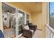 Spacious balcony with wicker furniture, perfect for relaxing at 7325 Black Walnut Way, Lakewood Ranch, FL 34202