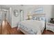 Guest bedroom with coastal decor and hardwood floors at 7325 Black Walnut Way, Lakewood Ranch, FL 34202