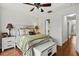 Spacious bedroom with wood flooring and an ensuite bathroom at 7325 Black Walnut Way, Lakewood Ranch, FL 34202