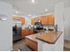 Galley-style kitchen with stainless steel appliances at 7325 Black Walnut Way, Lakewood Ranch, FL 34202