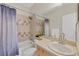 Clean bathroom with tub shower combo and updated vanity at 7664 Plantation Cir, Bradenton, FL 34201