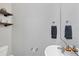 Clean and modern half bathroom with a floating sink and dark towels at 7664 Plantation Cir, Bradenton, FL 34201