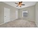 Spacious bedroom with neutral carpeting and ample closet space at 7664 Plantation Cir, Bradenton, FL 34201