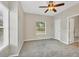 Charming bedroom with neutral carpeting and large window at 7664 Plantation Cir, Bradenton, FL 34201