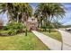 Community clubhouse with landscaping and walkway at 7664 Plantation Cir, Bradenton, FL 34201