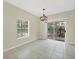 Tile floor dining room with sliding glass doors leading to a patio at 7664 Plantation Cir, Bradenton, FL 34201