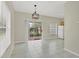 Bright dining area with tile floors and sliding glass doors to a patio at 7664 Plantation Cir, Bradenton, FL 34201