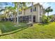 Exterior view of townhouses with lush landscaping at 7664 Plantation Cir, Bradenton, FL 34201