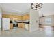 Open concept kitchen with light wood cabinets and stainless steel appliances at 7664 Plantation Cir, Bradenton, FL 34201