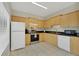 Well-equipped kitchen with light wood cabinets and granite countertops at 7664 Plantation Cir, Bradenton, FL 34201