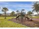 playground in a landscaped area at 7664 Plantation Cir, Bradenton, FL 34201
