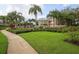 Landscaped walkway leading to community amenities at 7664 Plantation Cir, Bradenton, FL 34201