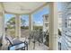 Relaxing balcony with seating for three, offering a view of the surrounding area at 7840 34Th W Ave # 203, Bradenton, FL 34209