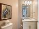 Small bathroom with granite countertop and white cabinets at 7840 34Th W Ave # 203, Bradenton, FL 34209