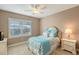 Charming bedroom with a queen bed and plantation shutters at 7840 34Th W Ave # 203, Bradenton, FL 34209