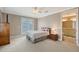 Guest bedroom with double bed, nightstand, and ensuite bathroom access at 7840 34Th W Ave # 203, Bradenton, FL 34209