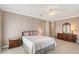 Bright bedroom with a queen-size bed, dresser, and nightstand at 7840 34Th W Ave # 203, Bradenton, FL 34209