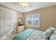 Comfortable bedroom with a queen bed and double doors at 7840 34Th W Ave # 203, Bradenton, FL 34209
