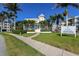 Community clubhouse with inviting entryway and landscaping at 7840 34Th W Ave # 203, Bradenton, FL 34209