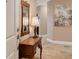 Elegant entryway with a wooden console table, mirror, and lamp at 7840 34Th W Ave # 203, Bradenton, FL 34209
