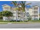 Three-story building with balconies and lush landscaping at 7840 34Th W Ave # 203, Bradenton, FL 34209