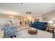Open living area with a sofa, chairs, and views into the kitchen and dining areas at 7840 34Th W Ave # 203, Bradenton, FL 34209