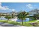 Scenic pond with reflecting buildings and lush landscaping at 7840 34Th W Ave # 203, Bradenton, FL 34209