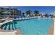 Inviting community pool with lounge chairs and umbrellas at 7840 34Th W Ave # 203, Bradenton, FL 34209