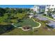 Community putting green surrounded by landscaping at 7840 34Th W Ave # 203, Bradenton, FL 34209