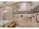 Large walk-in shower with glass enclosure and tile surround at 7840 34Th W Ave # 203, Bradenton, FL 34209